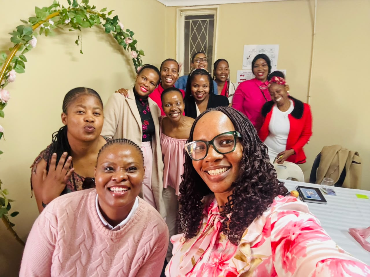 BuildingHer members smiling at an evening event